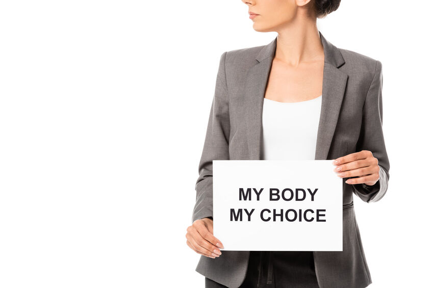 Cropped view of businesswoman holding placard with my body my choice lettering isolated on white