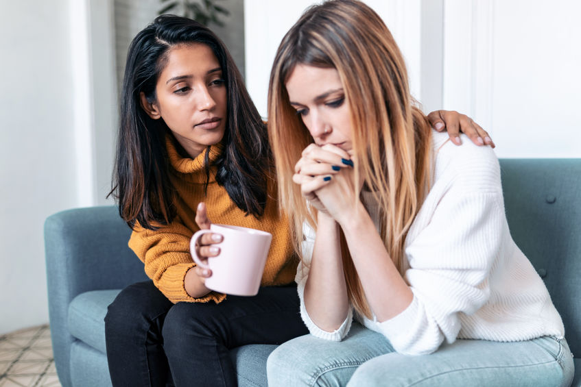 woman checking in on friend after abortion